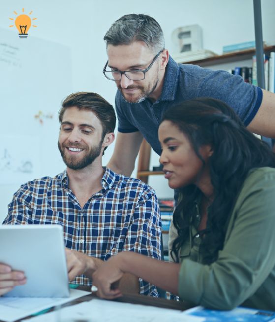 Photo of a group of people working together 
